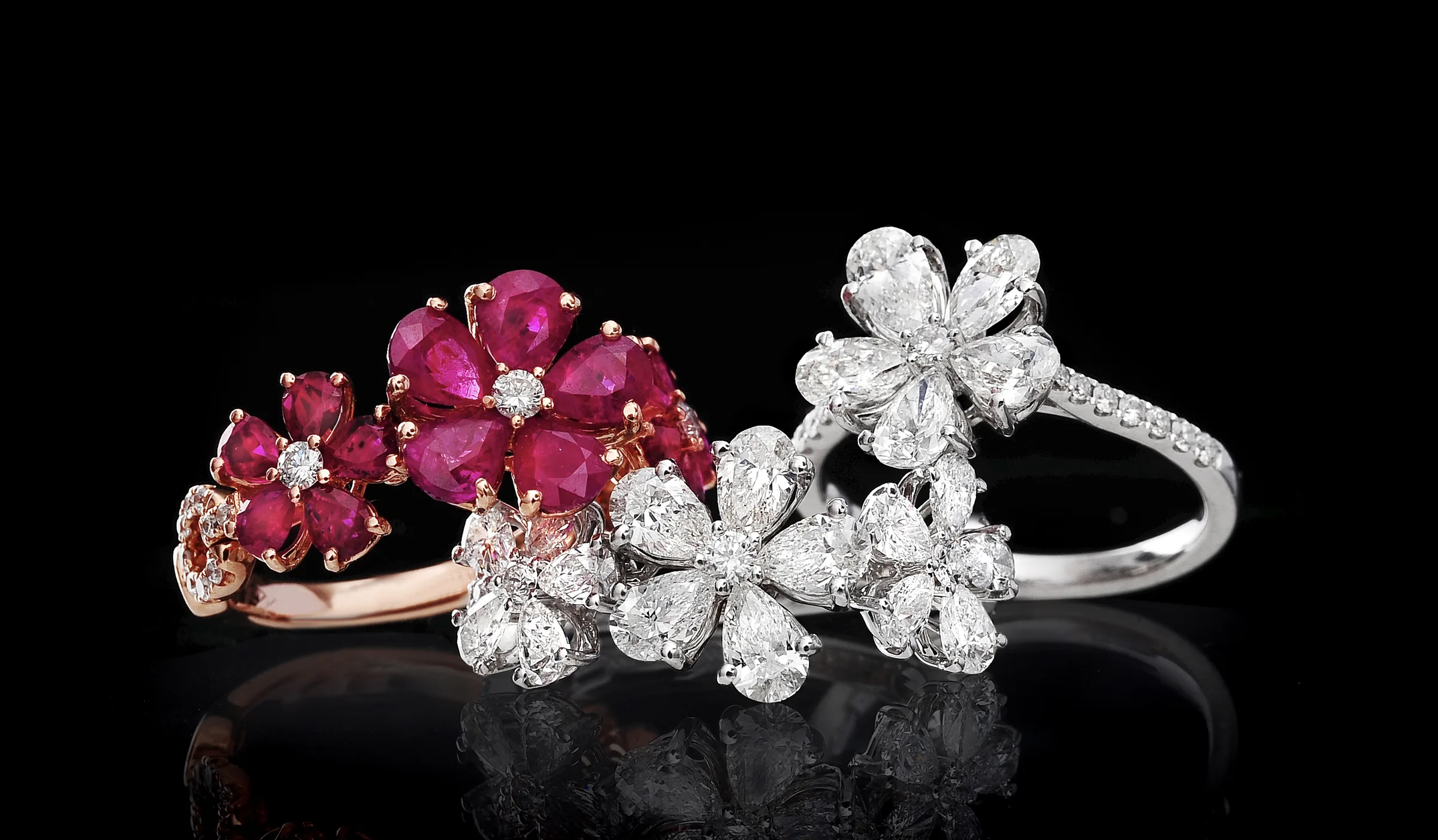 Bloom Alone flower rings with rubies, sapphires and diamonds