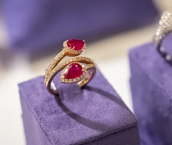 Ruby and diamond ring on purple velvet